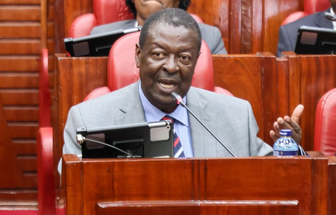 Prime Cabinet Secretary Musalia Mudavadi speaks into a microphone while seated in the Senate chamber.