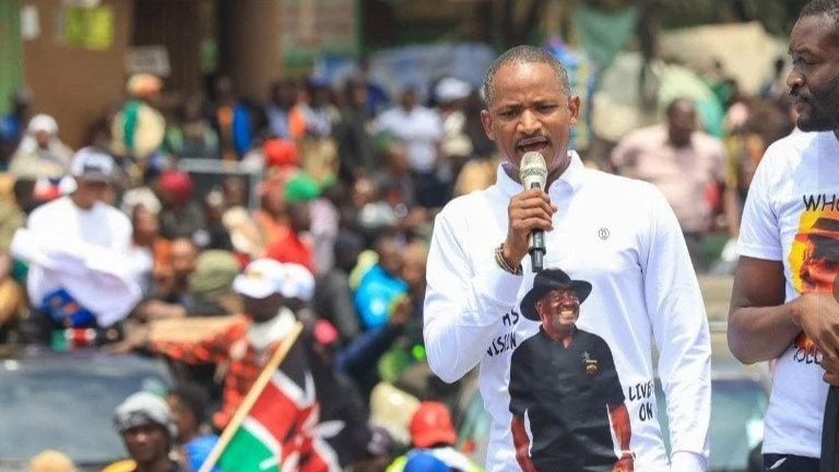 Babu Owino speaks into a microphone at Marikiti Market.